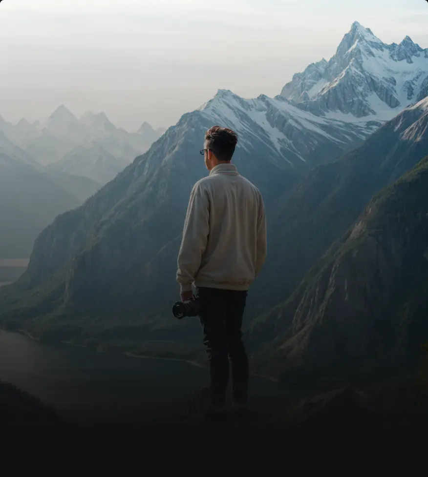 Photographer with a camera in the mountains